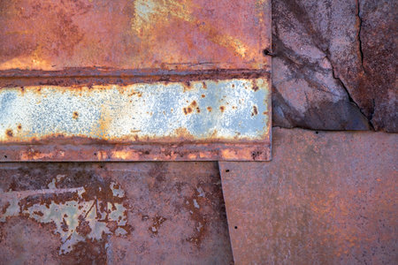 Abstract texture of rusty iron. The background is made up of several sheets of rusty iron.の写真素材