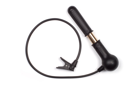 Air pump close-up on a white background. Manual air pump with hose.の写真素材