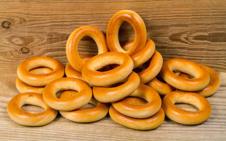 Bagels on the background of wood. A bunch of bagels. traditional bakery product.