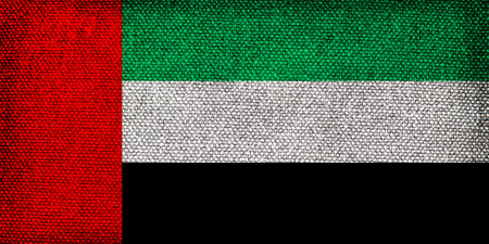 Flag of the United Arab Emirates with the texture of rough fabric. Stylized image of the UAE flag.の写真素材