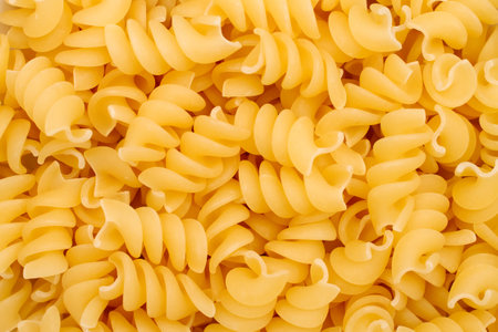 Pasta in the form of spirals. Background texture in the form of pasta.の写真素材