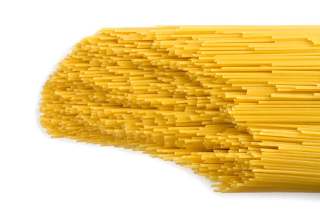 Raw pasta on a white background. Spaghetti pasta.の写真素材