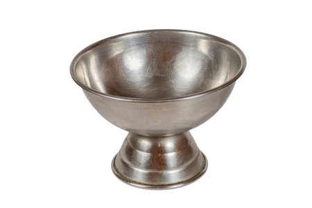 Antique stainless steel bowl on a white background. Vintage tableware.の写真素材