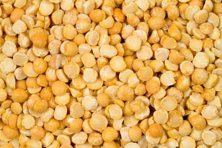 Raw pea groats. Background texture made of natural peas.