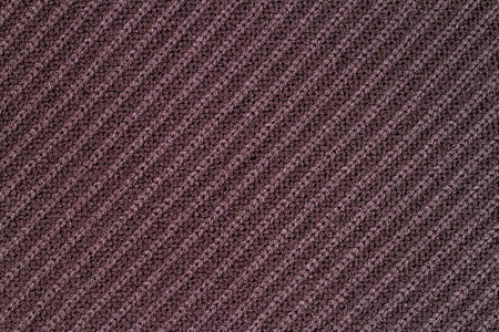 Horizontal texture of wool knitted fabric. Background texture of the fabric.