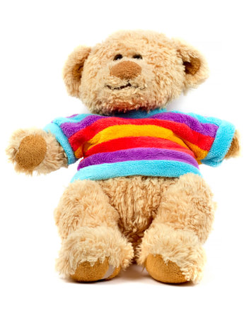 Teddy bear in a striped sweater. Children's toy close-up on a white background.