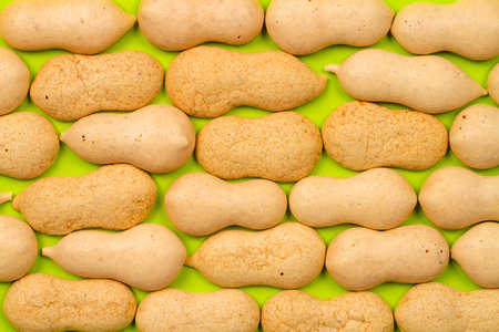 Cookie texture of the original shape. Confectionery on a green background.の写真素材