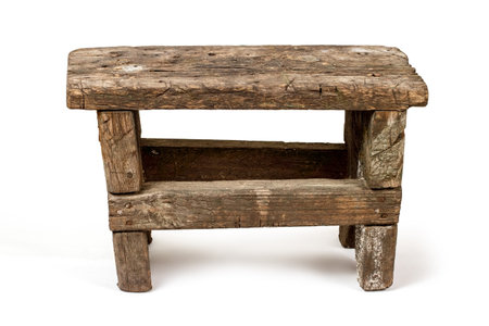 An old rustic bench. A chair made of rough boards on a white background.の写真素材