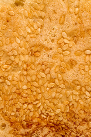 The texture of bread with sesame. The surface of a loaf of bread is close-up.の写真素材