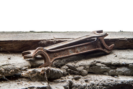 Rusty wrenches on an old stone surface. Old working hand tools.の写真素材