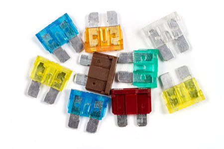 Automotive electric fuses on a white background. Fuses of different colors close-up.の写真素材