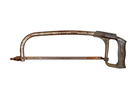 An old hacksaw on metal on a white background. Rusty hacksaw on metal.の写真素材
