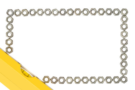 Frame made of iron nuts and a building level on a white background. Frame on the theme of repair,...