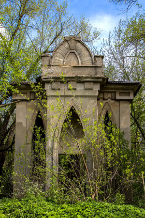 Architectural detail of an ancient building in the park in springの写真素材