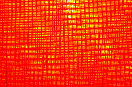 Refraction of light on a red wall. Abstract background for design.