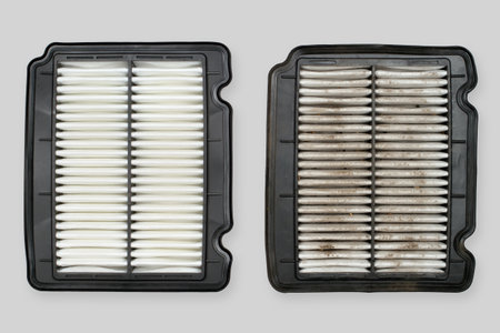 Clean and dirty car air filters. Air filters close-up on a gray background.の写真素材