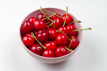 Bowl of cherries on a gray background. Fresh natural organic cherry.の写真素材