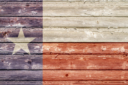 The flag of the state of Texas with the texture of old wooden boards. Flag with the texture of rough boards.の写真素材