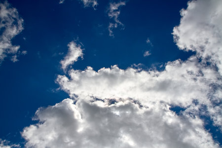 Dark blue sky with cumulus clouds. Summer sky after rain.の写真素材