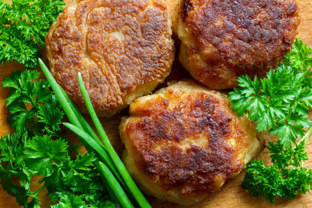 Meat balls with herbs close-up. Homemade meat cutlets on the background of wood.の写真素材