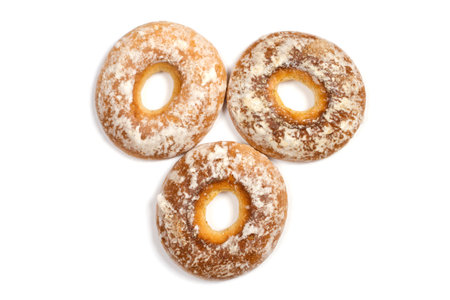 Three bagels with icing on a white background. Gingerbread with a hole.の写真素材
