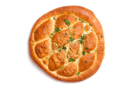 Homemade pie on white background. A large round pie with herbs. Fresh baked goods isolated on white background.の写真素材
