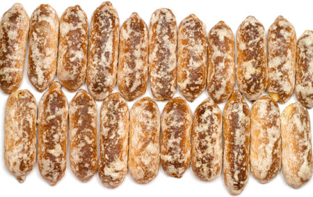 Lots of traditional glazed gingerbread. Gingerbread texture. Gingerbread on a white background, top...