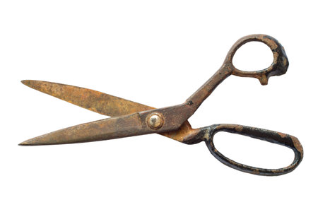 Old rusty scissors isolated on white background. Iron scissors close-up.の写真素材