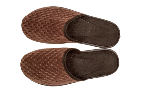 Brown house slippers isolated on a white background. Close-up of slippers. Top view.