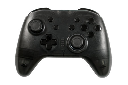 Game joystick gamepad on a white background. Black gamepad close-up.