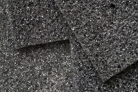 Texture of black foam rubber close-up. Samples of black foam rubber.の写真素材