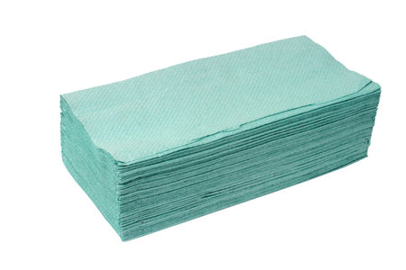 Stack of green paper towels isolated on white background. Close-up of paper towels.の写真素材