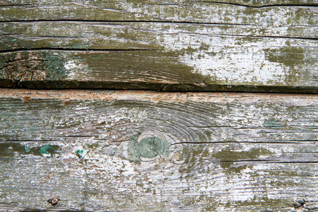 The texture of old wooden boards. An old cracked wooden surface with peeling paint.の写真素材