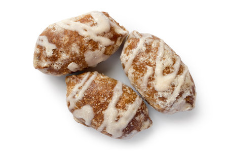Three gingerbread on a white background with a shadow. Close-up of sweet glazed gingerbread.の写真素材