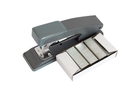Stationery stapler with staples on a white background. A close-up of a modern stapler.の写真素材