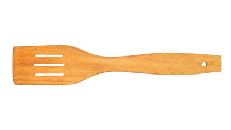 Kitchen wooden spatula on a white background. Close-up of wooden kitchen utensils.の写真素材
