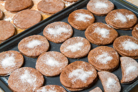 Making homemade cookies in the kitchen. Cookies on a metal sheet.の写真素材