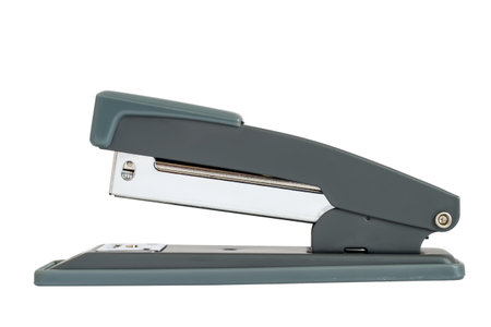 Modern office stapler on a white background. Stapler close-up side view.の写真素材