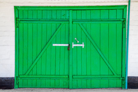 Green wooden garage door. Garage doors made of wooden boards.の写真素材
