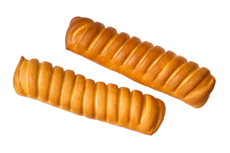 Two sweet striped buns on a white background. Sweet long rolls are isolated.