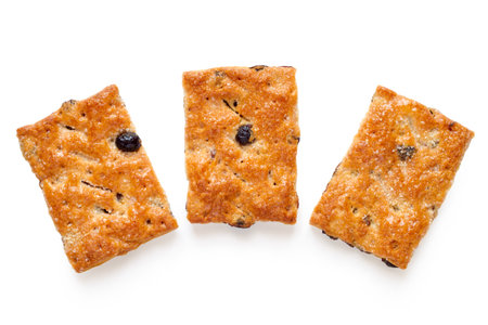 Three raisin cookies on a white background. Fresh puff biscuits with raisinsの写真素材
