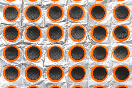 A lot of self-adhesive patches for a bicycle inner tube. Patches for tire repairの写真素材