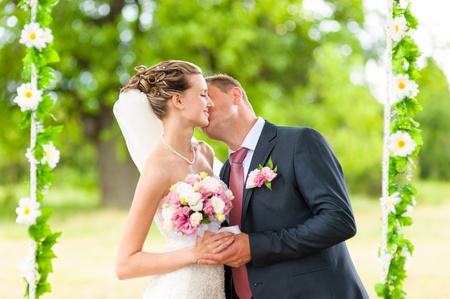 Groom and  bride on green gladeの写真素材