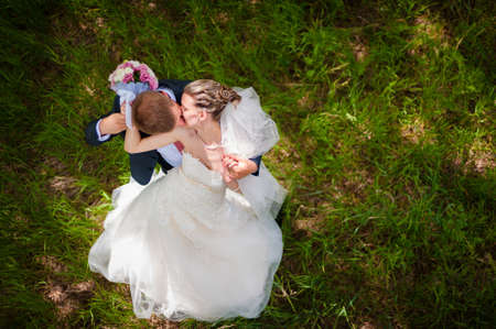 Groom and  bride on green gladeの写真素材