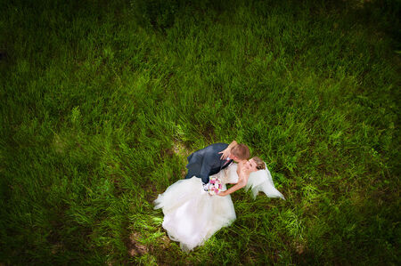 Groom and  bride on green gladeの写真素材