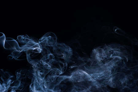 Abstract smoke moves on a black background