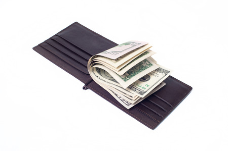 leather wallet with banknotes isolated on whiteの写真素材