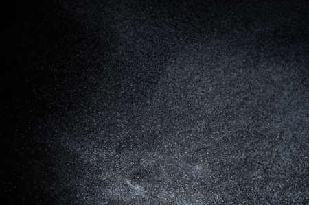 Abstract splashes of water on a black backgroundの写真素材