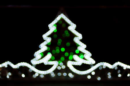Blurred christmas tree lights on black backgroundの写真素材