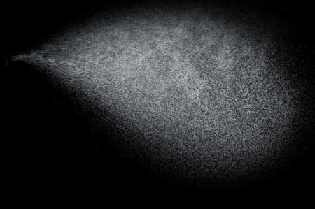 abstract splashes of water on a black backgroundの写真素材